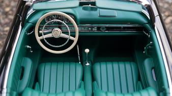 top view of green leather interior of retro mercedes car