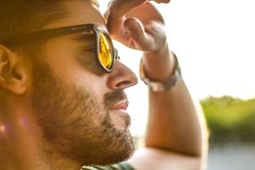 portrait of a man in sunglasses on a blurred background