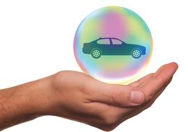 car in a bubble on hand