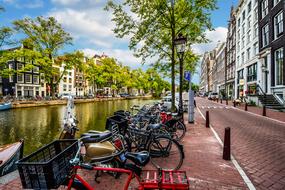 parked bicycles on a city street in amsterdam