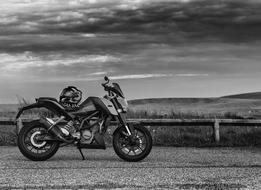 monochrome photo of motorcycle on rural road