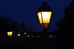 Beautiful lanterns, with the colorful lights, on the street, among the darkness, at the night