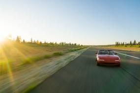 Mazda Car on road at sunlight