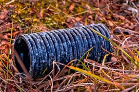 photo of metal part on meadow