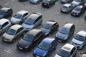 panoramic view of cars in the parking lot in the city