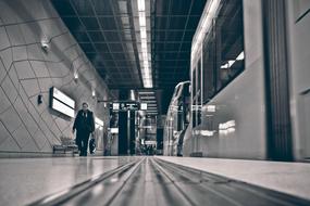 Black and white photo of the metro station with person in DÃ¼sseldorf, Germany