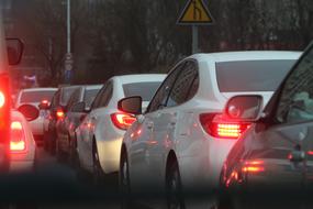 traffic jam and narrowing road sign