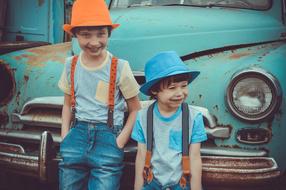 funny boys near the retro car