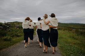 Women Friends walking road