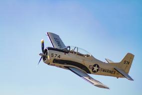 the plane flies over the airfield