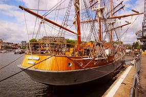 luxury wooden yacht is moored in the harbor