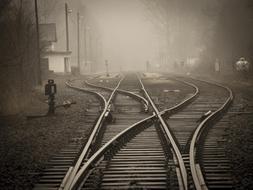 railroad switch on station in mist