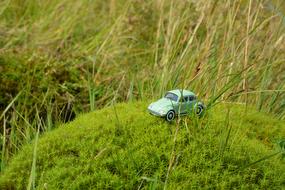 toy car volkswagen model on green moss