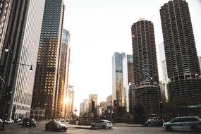 evening photo of traffic and glass skyscrapers