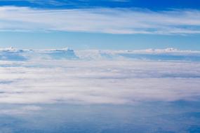 Beautiful white clouds in gradient blue sky