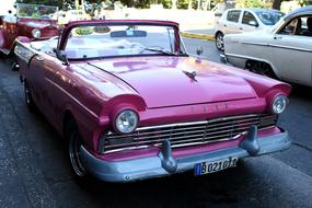 pink ford car on the street of cuba