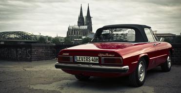 Beautiful cityscape with shiny red car