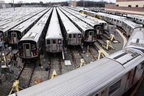 many trains parked on the railway tracks