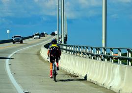 cyclist on road bridge