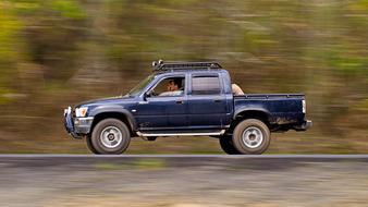 pickup rides at high speed on the highway