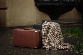 Suitcase Rain on Street