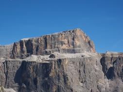Beautiful landscape of the Sass Pordoi of Dolomites in Italy, at blue sky on background