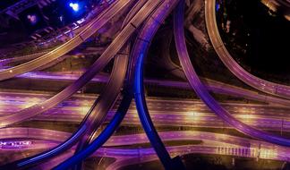 multi-colored night illumination of a road junction