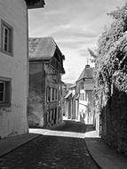 narrow street in the city of europe in black and white background