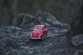 red toy car stone