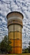 Beautiful and colorful tower at blue sky background with white clouds