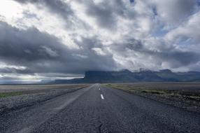 photo of a stormy sky over a freeway