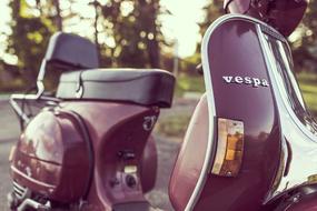 photo of burgundy Vespa Scooter