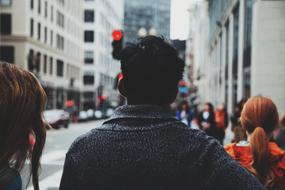 evening photo of people walking along the street