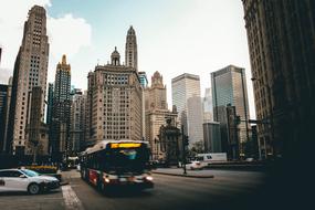 city bus on the background of skyscrapers