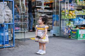 little girl on the city street