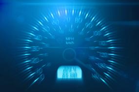 speedometer in blue blurred background