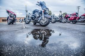 parked motorcycles on a wet road