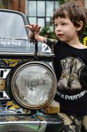 portrait of Boy near Machine Light