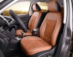 Beautiful interior of the car with brown and black seat cushions