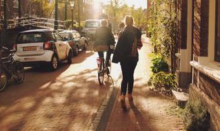 girls walk along city street in Leiden, Netherlands