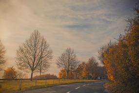 countryside highway in autumn landscape