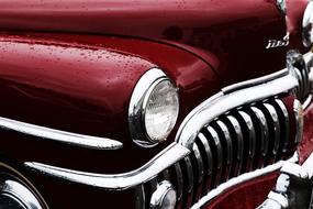 round headlights of a red retro car