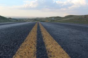 yellow marking strip on the asphalt close up