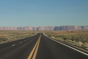 Beautiful landscape of the road, among the colorful fields and mountains, in the Grand Canyon, Arizona, USA