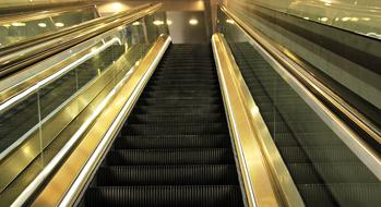 Beautiful escalator with lights on the railway station