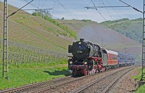 Colorful steam locomotive, among the colorful and beautiful vineyards, in the Saar Valley in Saarburg, Germany