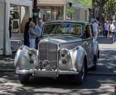 silver retro bentley car on the street