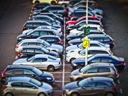 Rows of the colorful, shiny cars, on the parking lots