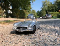 silver mercedes convertible on the pavement