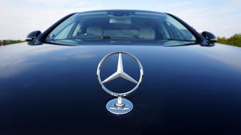 chrome mercedes-benz badge on the hood